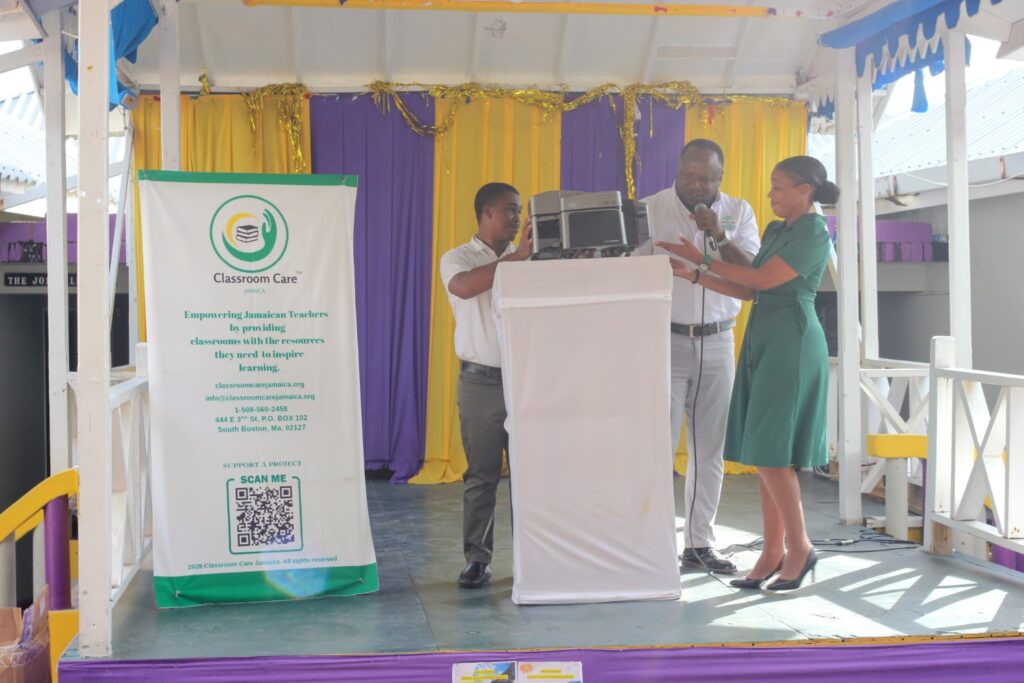 Representatives presenting the donated ID card printer at Happy Grove High School